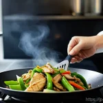 중식 요리 비법 - **"Mastering Wok Hei at Home"**
    A focused shot of an adult home cook, wearing a clean, simple ap...
